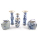 A pair of Chinese blue and white gu-shape vases, reserves painted with figu