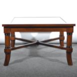 A mahogany coffee table, glass inset top, 71cm square, height 42cm.