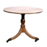 A Victorian mahogany tripod table, circular tilt top, with a reeded edge, t