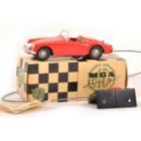 Victory Industries plastic battery operated model; MGA sports car in red, boxed with leaflet.