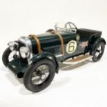A Bentley Speed 6 pedal car; 1.5m in length, painted with British racing green, no.6 side decals