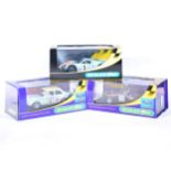 Three Scalextric slot-car racing models.