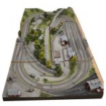 Large railway layout; comes in four self containing wooden cases, with good landscaping of trees,