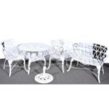 Four-piece suite of white painted metal garden furniture.