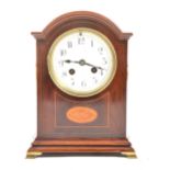 An Edwardian inlaid mahogany mantel clock