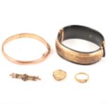 A 9 carat yellow gold half hinged bangle, small diamond ring, bar brooch, back and front locket,