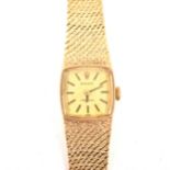 Rolex - a 9 carat yellow gold bracelet watch.