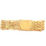 A Gold Full Sovereign gate link bracelet.