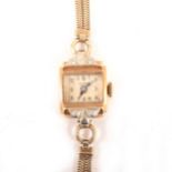 Birks - A lady's yellow metal wrist watch.