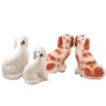 A pair of Staffordshire flat back spaniels and two others.
