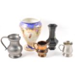 A collection of ceramics and pewter ware.