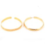 Two yellow metal bangles - one marked 14K