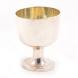 A white metal cup