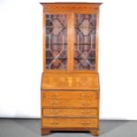 An Edwardian inlaid mahogany bureau bookcase