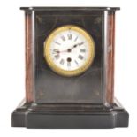 A Victorian black marble mantel clock