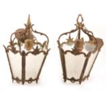 Three brass framed lantern light fittings