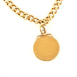 An 18 carat yellow gold single albert watch chain with Spade Guinea attached.