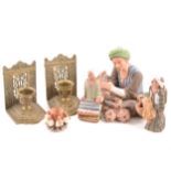 A collection of Peruvian figures, a brass pocket compass and a pair of cast brass book ends.