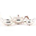 A silver three piece teaset, London 1911, makers mark CCP, stylised fern leaf decoration to lower