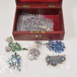 Twelve pot metal brooches and dress clips - possibly by Brier USA, in a red jewel box with key