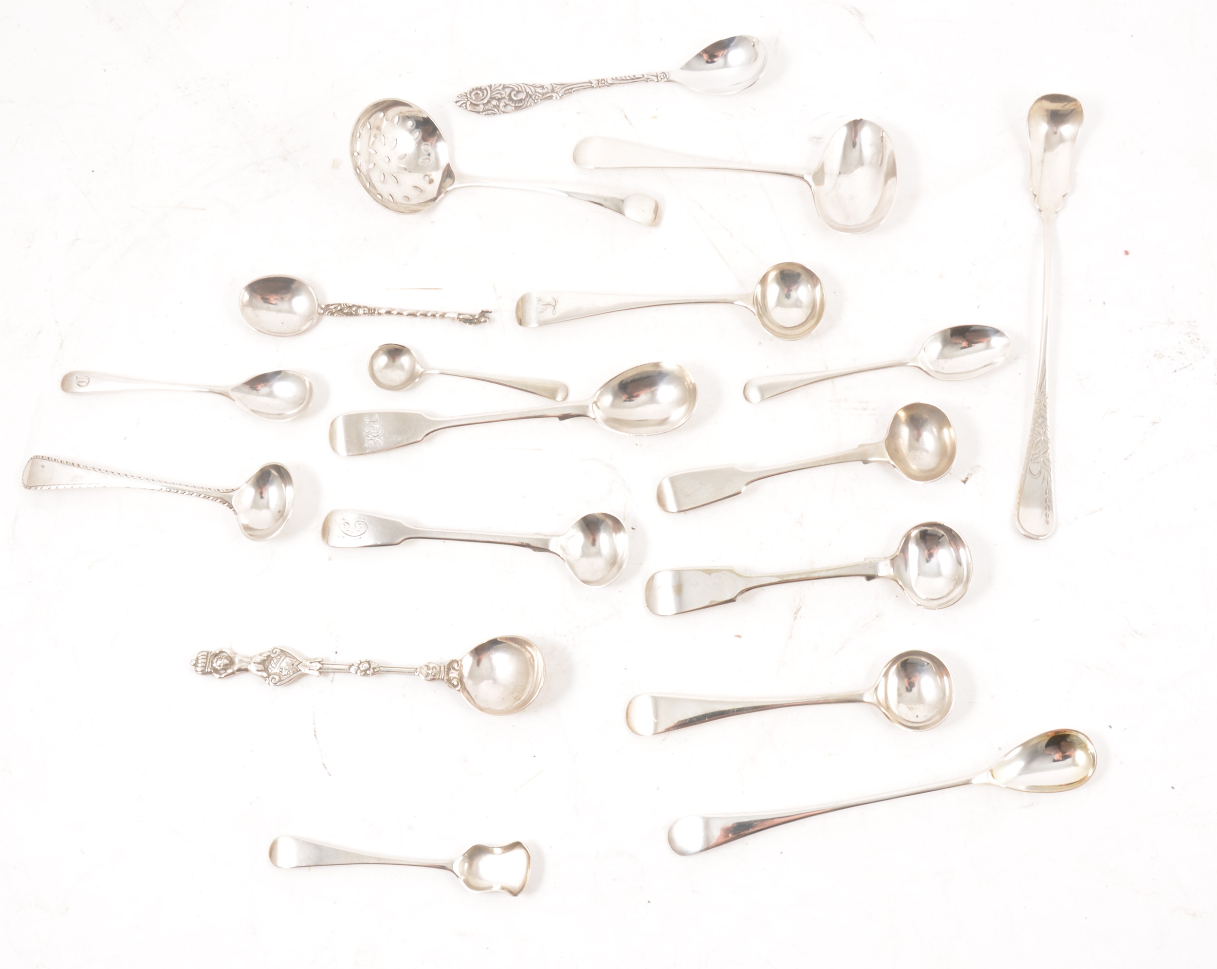 A collection of silver condiment spoons.