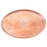 Hugh Wallis, an arts and crafts oval copper tray with floral pewter inlay, 50cm x 33cm.