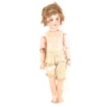 A French SFBJ bisque head doll with walking and head turning mechanism.