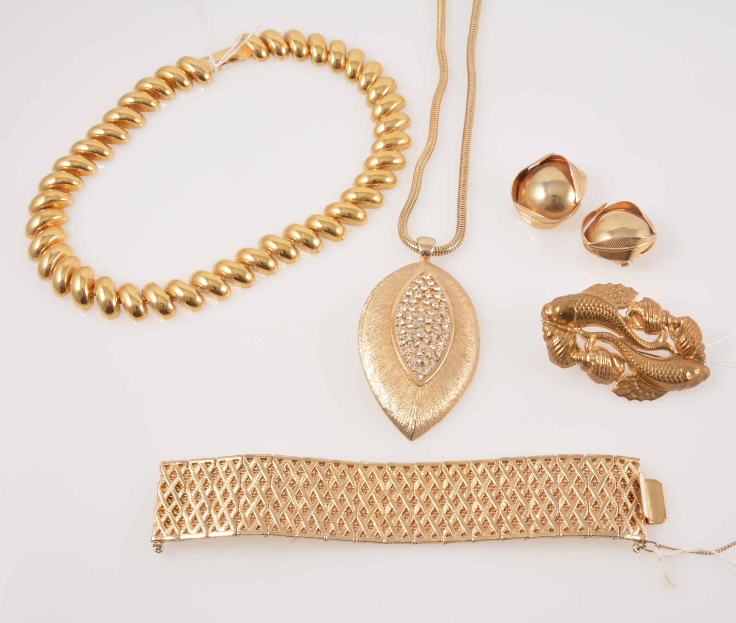 A collection of bold vintage gilt metal costume jewellery,