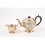 Silver teapot and milk jug