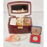 A box of costume jewellery, pearl and coral necklaces, modern pill boxes.
