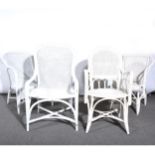 Four various white painted cane conservatory chairs.