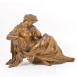 Gilt metal sculpture of a reclining lady