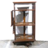 An Edwardian oak revolving library boocase