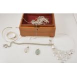A collection of silver necklaces, pendants and bangle.