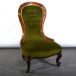 A mahogany framed balloon back nursing chair