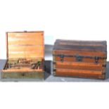 A banded domed trunk, wooden box and quantity of old tools.