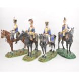 A set of four Dresden porcelain military equestrian models,