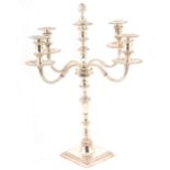 A George II style silver four branch candelabrum,