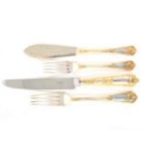 An extensive canteen of silver and parcel gilt cutlery,