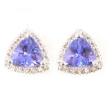 A pair of tanzanite and diamond cluster earstuds.