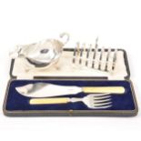 Silver sauceboat, Barker Ellis Silver Co., Birmingham 1965, plus a silver toast rack and