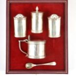 A matched five-piece silver condiments set in the Art Deco style.