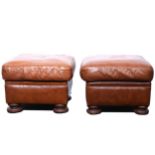 Pair of modern brown leather footstools,