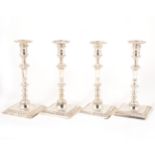 A set of four George II silver candlesticks,
