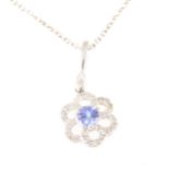 A tanzanite and diamond pendant and chain