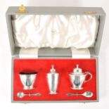 A five-piece silver condiment set,