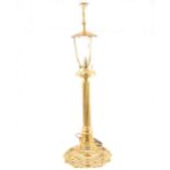 Cast brass table lamp, eagle finial, scrolled and fluted base, height 77cm.