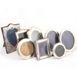 A pair of silver oval photograph frames, Carr's of Sheffield, Sheffield 2005, plus six more of