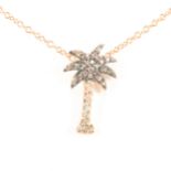 A chocolate and white diamond novelty palm tree pendant and chain