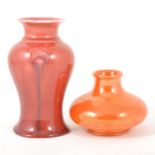 A William Moorcroft 'Flammian' ware vase for Liberty & Co, circa 1920, and an orange lustre vase